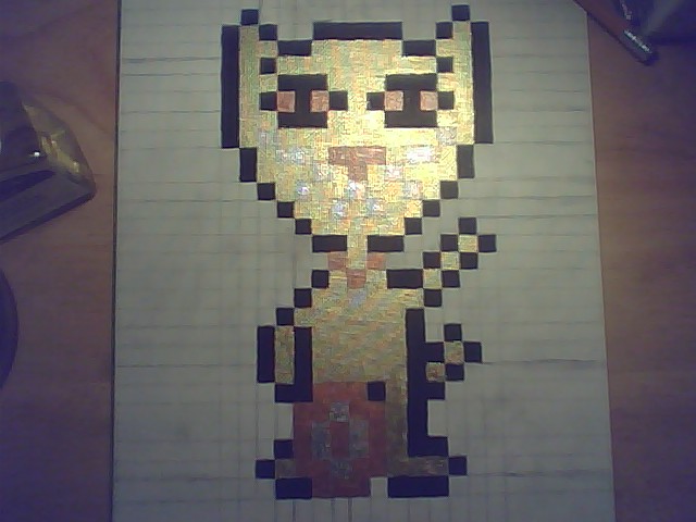 Progress photo of golden maneki neko pixel painting